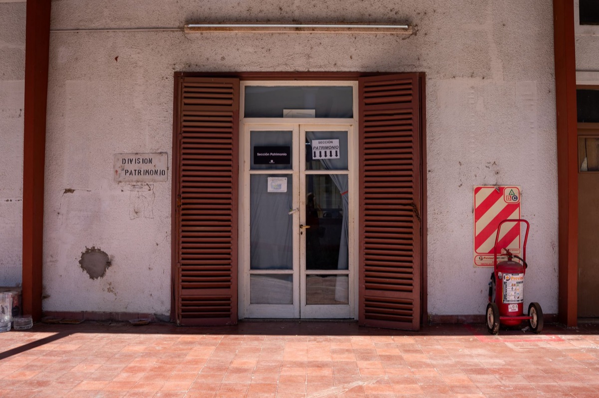 Medical center entrance with sign and waiting area